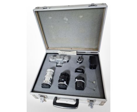 An aluminium camera case containing Soviet Kiev camera, numbered 7506242, 4/135 lens, Jupiter-9 2/85 lens, Jupiter-12 2.8/35 