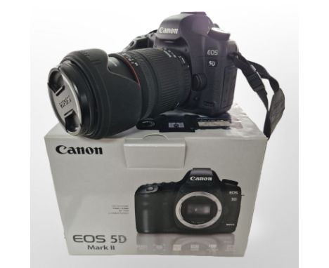 A Canon EOS 5D Mark II digital camera, with Sigma zoom 28-300mm 1:3.5-6.3DG macro lens, with original box containing leads, i