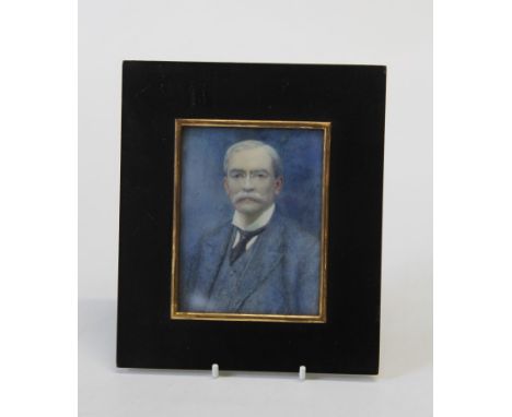 Edwardian English School, bust length portrait miniature of bespectacled gentleman wearing a blue suit. Watercolour, 11 x 8cm