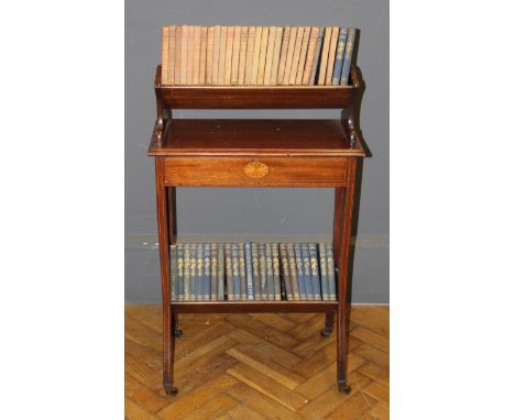 An Edwardian mahogany and pataral inlaid occasional bookcase, the upper shelf over a frieze drawer raised on sinuous in legs 