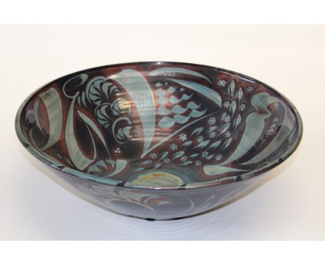 Alan Caiger- Smith 1930 -2020 British  A large deep circular pottery bowl. The iridescent blue/brown ground decorated with mo