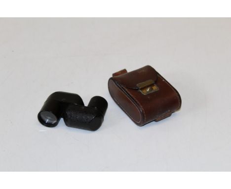 A cased Carl Zeiss Turman x8 pocket monocular, probably 1930's, width 7cm