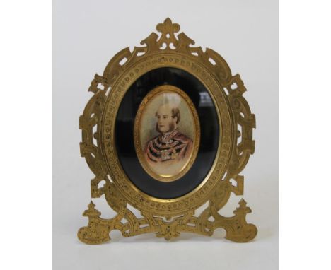 19th century European School, bust length portrait miniature of a highly decorated Nobleman. The cut brass easel support fram