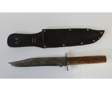 A Bowie knife with staghorn grip in leather scabbard. Total length, 34cm