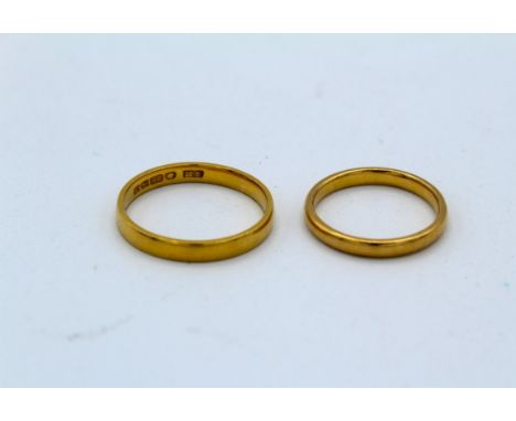 Two 22 carat gold band rings, size O and size K. Gross weight&nbsp;approximately 5.96 grams