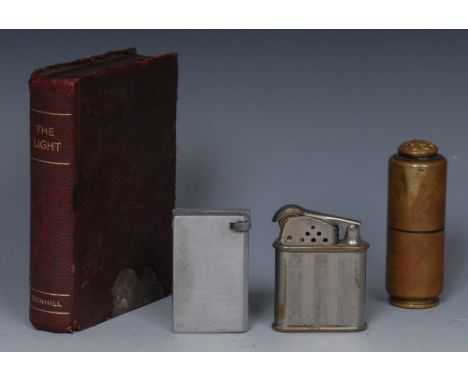A Dunhill novelty table lighter, The Light, as a book, morocco clad case, hinged cover enclosing a striking mechanism, 11cm l