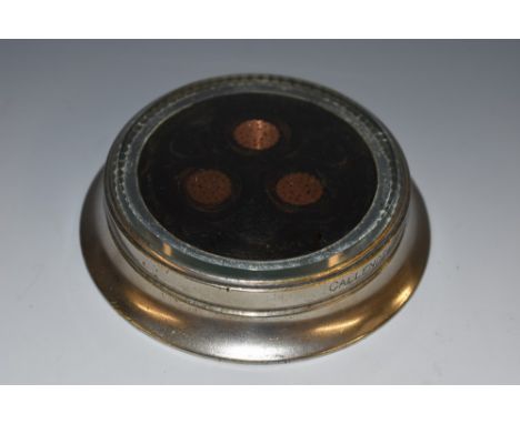 An early 20th century novelty desk weight, formed from a transverse section of cable, inscribed Callender's 15 Three Phase Ex