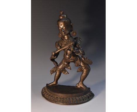 Indian School (19th century), a bronze, of a deity holding a kendi, demi-lune base with lotus border, 27cm high