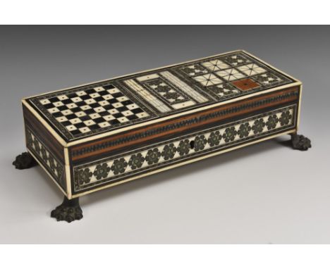 A 19th century Anglo-Indian Sadeli marquetry rectangular games box, hinged cover inlaid for chess, cribbage and further games