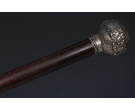 A 19th century silver-mounted exotic hardwood gentleman's walking stick, the globular silver pommel cast with a garland of oa