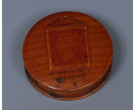 A Victorian Scottish oak souvenir circular snuff box, the cover printed with a penny red stamp and inscribed Made of Wood Gro