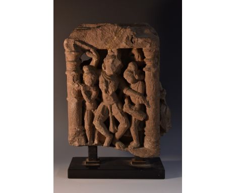 Antiquities - an Indian stone stele or architectural fragment, carved with deities within a niche, 28cm high, 19cm wide, c.11