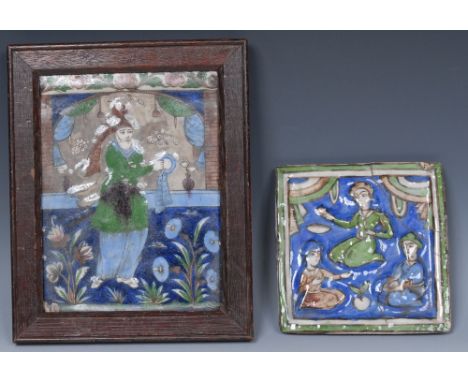 A Qajar rectangular tile, moulded and painted in the Iznik palette in polychrome with an official, 21.5cm x 16cm, framed; ano