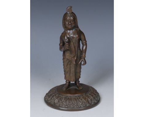 An Indian bronze figure, a lady of the court, she stands, hiolding a lotus, circular base with cast acanthus border, 16.5cm h