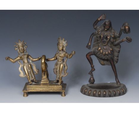 Indian School (19th century), a bronze, of a deity, lotus base, 23.5cm high; another 19th century shrine group, cast as two d