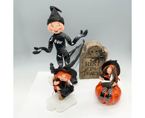 Alluring collection of Halloween decor that consists of a tall spider elf, a witch flying on her broomstick, a witch reading 