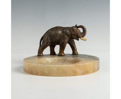 This sophisticated retro vide poche home decor is carved from marble, featuring a recessed bowl and adorned with a lovely bro