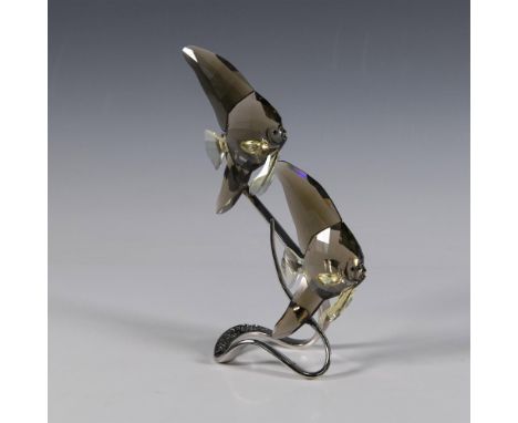 Two fishes crafted from smoky quartz crystal with a silver-tone metal stand, highlighting the elegance of this ocean scene. S