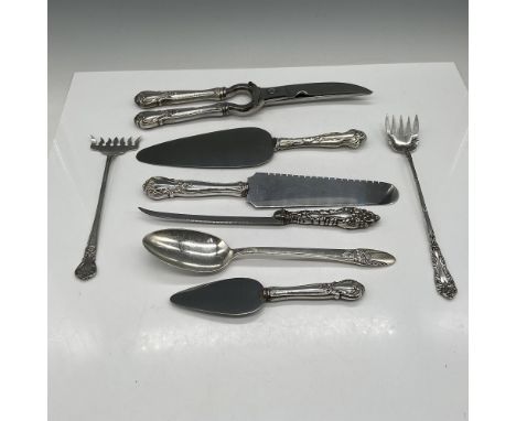 Each silver handle has an engraved design of flowers and scrolls attached to stainless steel utensil head. Lot includes - saw