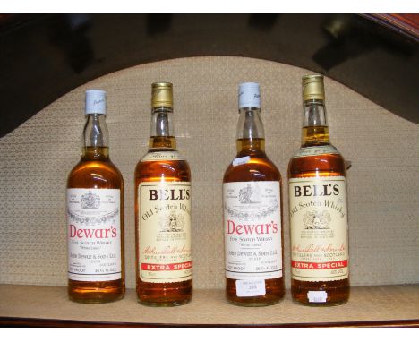 A Dewar's Fine Scotch Whisky, together with three others