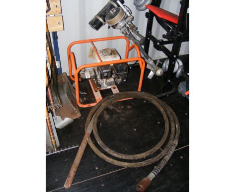 A petrol driven concrete vibrator drive unit  together with a vintage outboard motor