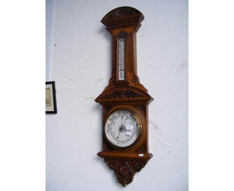 A late Victorian oak cased barometer/thermometer 