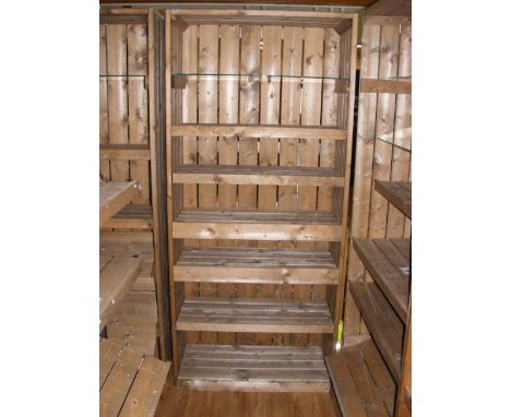 A similar pine shop display stand with five wooden shelves and one plate glass shelf