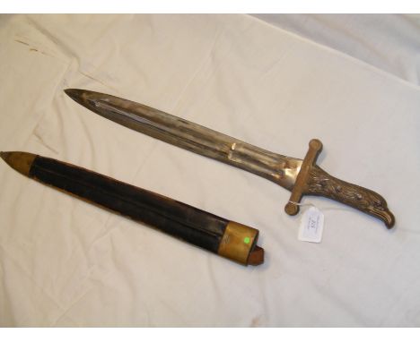 An Indian sword with eagle grip and leather scabbard - 67cms longCONDITION REPORT.
