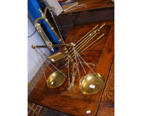 An antique set of weighing scales together with fire irons