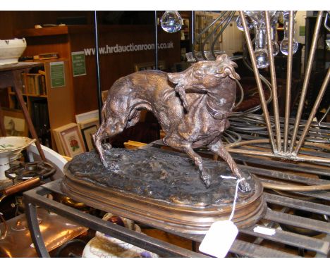 A reproduction bronze figure of hunting dog