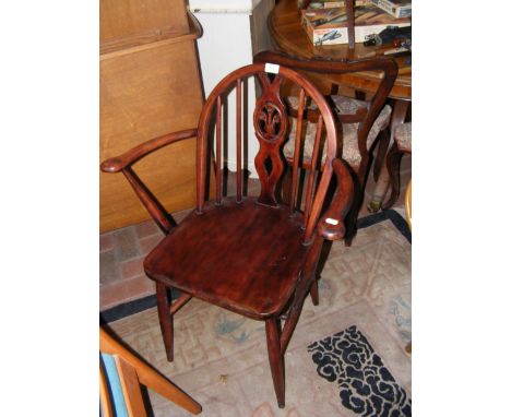 A stick back arm chair