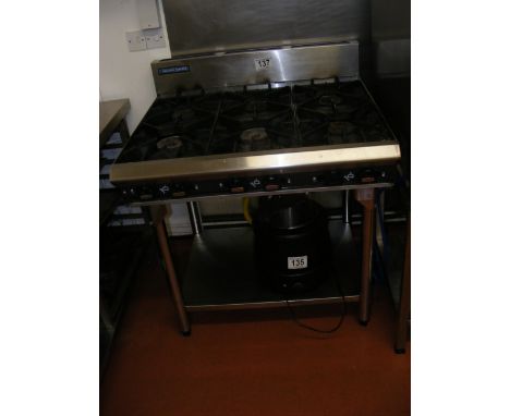 A Blue Seal six burner commercial gas range with pot shelf under