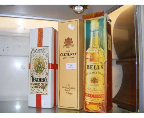 A boxed bottle of Glenlivet 12 year old Highland Malt Scotch Whisky, together with two others