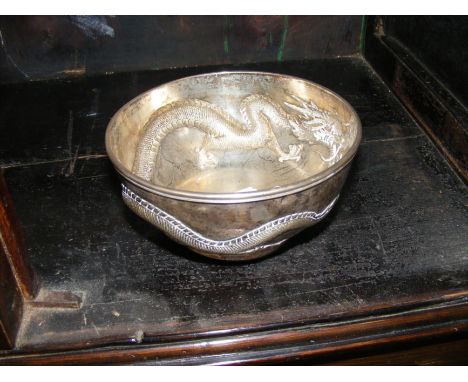 A heavy silver Chinese bowl with stylised dragon repousse work and mark to base - 13.5cm diameter   CONDITION REPORT 250gseem