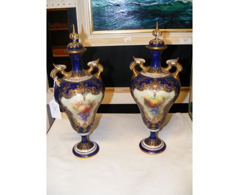 A pair of hand painted Royal Worcester two handled vases with covers - the base marked 2426 - 31cms highCONDITION REPORTone v