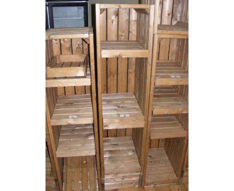A three tier pine shop display shelf unit
