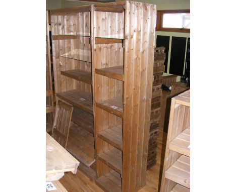 A similar pine shop display stand with four wooden shelves and one plate glass shelf