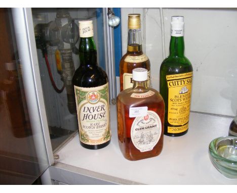 A Glen Grant Highland Malt Scotch Whisky, together with three others