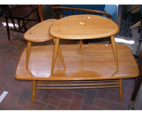 A vintage mid century Ercol Golden Dawn coffee table, together with matching pair of 'pebble' tables CONDITION REPORT.