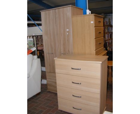 A light oak veneered chest of four drawers, together with similar two door wardrobe 