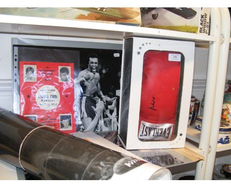 A collection of boxing memorabilia including Muhammed Ali signed boxing glove, signed photographs and original Light Heavywei