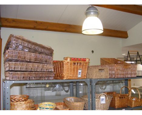 Sundry metal and canework trays (all of the contents of the top shelf)