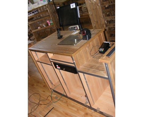 A shop check-out counter with integral screen, scales and cash drawer