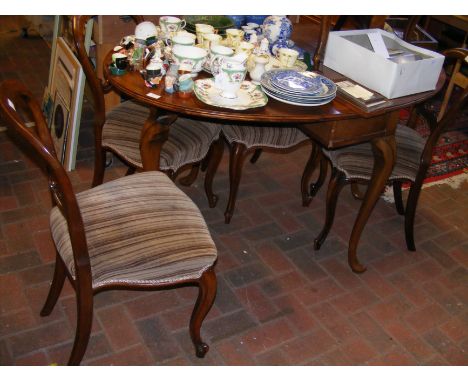 A mahogany oval gate-leg table with five balloon back chairs 