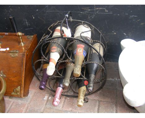 Selection of vintage champagne in iron rack including a bottle of 1975 Dom Perignon CONDITION REPORT Our team of trusted expe