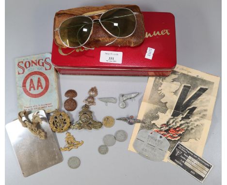 Collection of WWII period militaria to include: RAF and Royal Artillery badges, German coins, Prisoner of War Dog Tag - 'Stal
