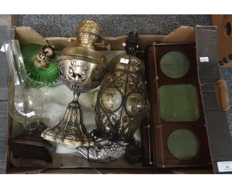 Box of various items to include; oil lamps; one with fruit moulded cast metal base and green glass reservoir, brass oil lamp,