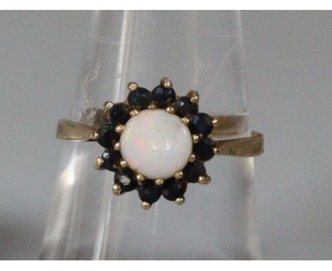 9ct gold opal and red stone dress ring.  2g approx.  Size M.   (B.P. 21% + VAT) 