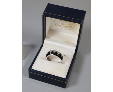 White metal stone set and black enamel dress ring marked 18K HJE.   (B.P. 21% + VAT) 