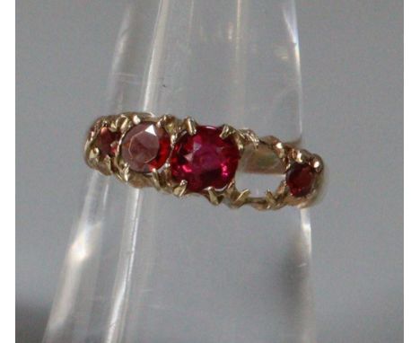 9ct gold five red stone dress ring, one stone missing.  1.6g.  Size M.   (B.P. 21% + VAT) 